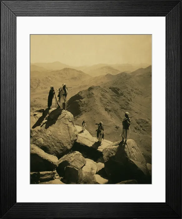 Framed Print : Mount Sinai, men with rifles standing on boulders looking out over valley and mountains, south by West, from the summit of Mount Catherine Framed Print : Mount Sinai, men with rifles standing on boulders looking out over valley and mountains, south by West, from the summit of Mount Catherine