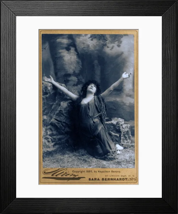 Framed Print : Sarah Bernhardt (1844-1923), French actress, in dramatic pose, kneeling with arms raised. Ca. 1892 Framed Print : Sarah Bernhardt (1844-1923), French actress, in dramatic pose, kneeling with arms raised. Ca. 1892