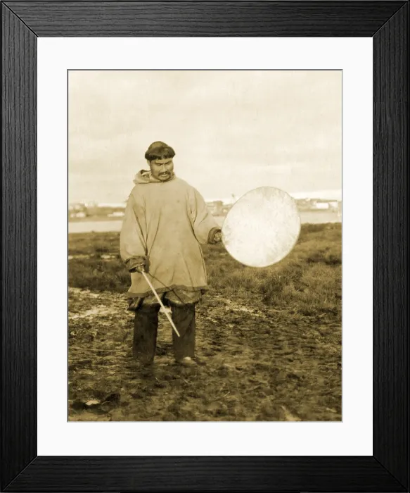 Framed Print : Drummer for Eskimo dance in Nome Alaska. The traditional Inuit drum was made of an animal skin stretched over a circular wood hoop Framed Print : Drummer for Eskimo dance in Nome Alaska. The traditional Inuit drum was made of an animal skin stretched over a circular wood hoop