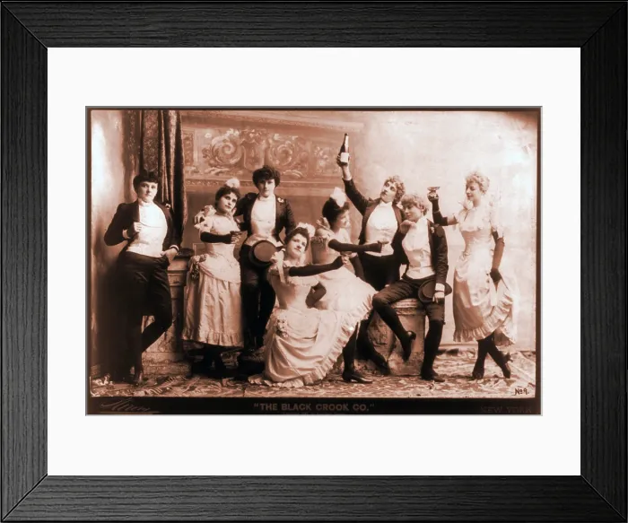 Framed Print : The Black Crook Company, portraying four couples in evening dress drinking champagne. The musical group employed the European practice of using females in male roles. 1893