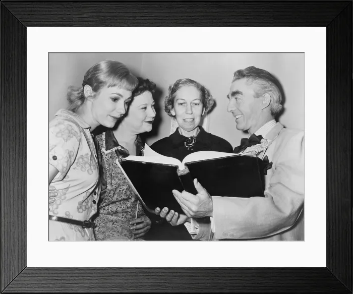 Framed Print : Jeanne Shelley, Una Merkel, Eudora Welty and David Wayne look over script for Welty's 'The Ponder Heart, ' in which Wayne starred at the Music Box Theatre. 1956