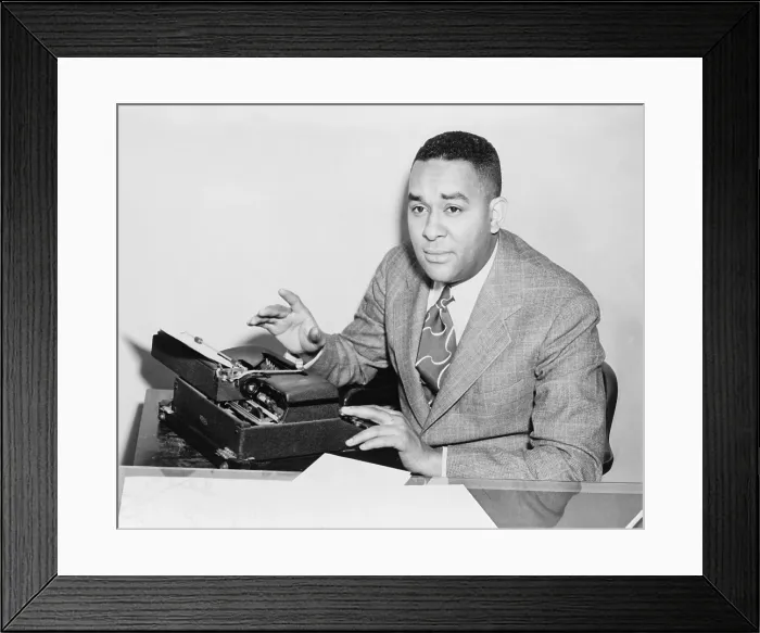 Framed Print : Richard Wright (1908-1960), seated at typewriter in 1945, the year he published his autobiography, 'Black Boy.'