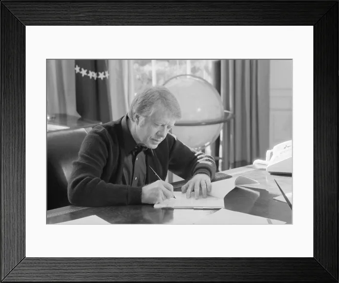 Framed Print : President Jimmy Carter working at his desk in the White House Oval Office. Ca. 1977-1980 Framed Print : President Jimmy Carter working at his desk in the White House Oval Office. Ca. 1977-1980