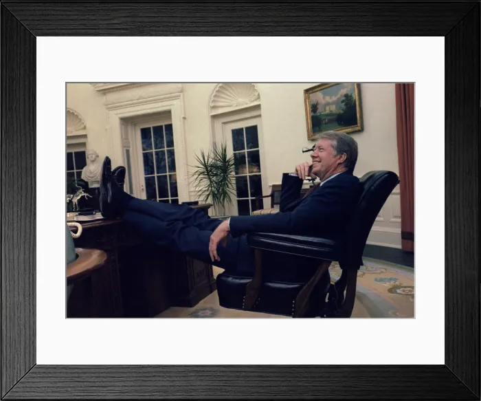 Framed Print : President Jimmy Carter sitting with his feet on the desk and smiling after Senate ratification of the Panama Canal Treaties. March-April 1978 Framed Print : President Jimmy Carter sitting with his feet on the desk and smiling after Senate ratification of the Panama Canal Treaties. March-April 1978