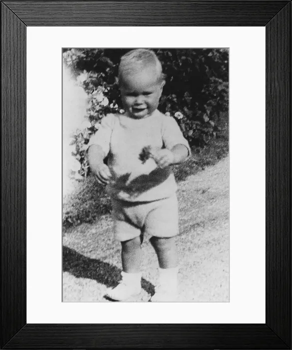 Framed Print : Future US President George H.W. Bush walking with a flower in his hand at age of one and a half. Ca. 1925 Framed Print : Future US President George H.W. Bush walking with a flower in his hand at age of one and a half. Ca. 1925