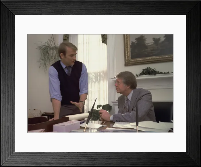 Framed Print : President Carter and his Press Secretary Jody Powell in conversation in the White House Oval Office. Ca. 1977-1980 Framed Print : President Carter and his Press Secretary Jody Powell in conversation in the White House Oval Office. Ca. 1977-1980