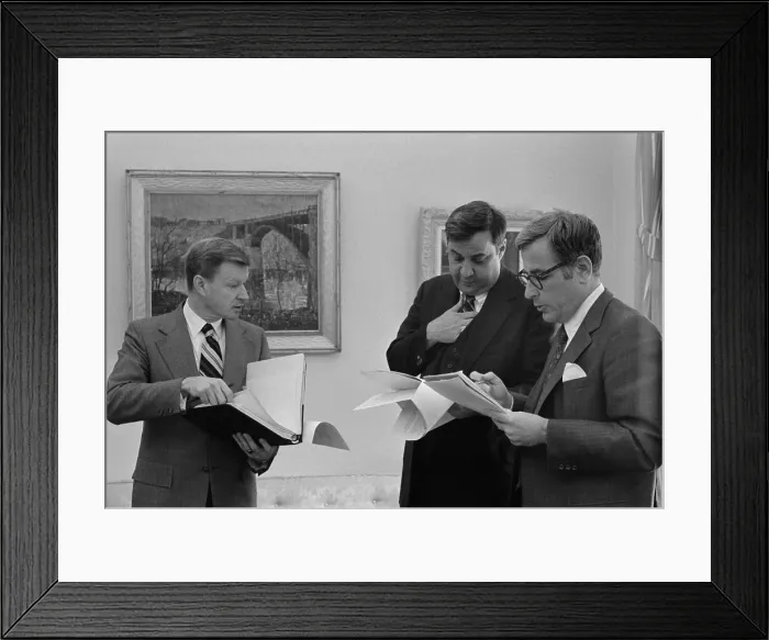 Framed Print : Carter Administration senior advisors in a stand up meeting at the White House L to R Zbigniew Brzezinski National Security Advisor Bert Lance Director of the Office of Management Framed Print : Carter Administration senior advisors in a stand up meeting at the White House L to R Zbigniew Brzezinski National Security Advisor Bert Lance Director of the Office of Management