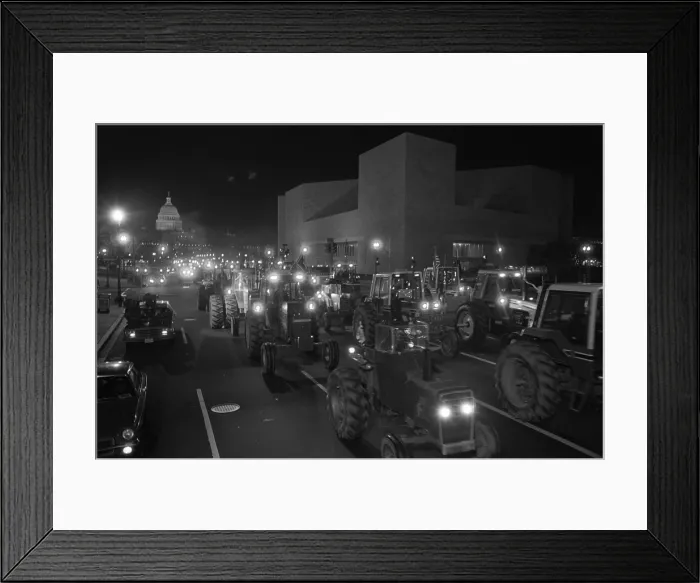Framed Print : Farmers driving tractors down Pennsylvania Avenue as part of a night time American Agriculture Movement AAM protest for higher government farms subsidies