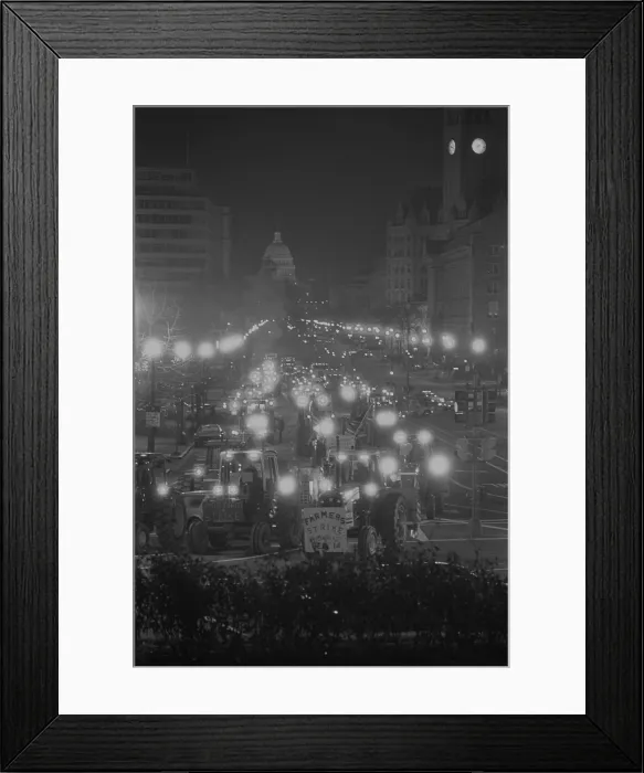 Framed Print : Farmers driving tractors down Pennsylvania Avenue as part of a night time American Agriculture Movement protest for higher government farms subsidies