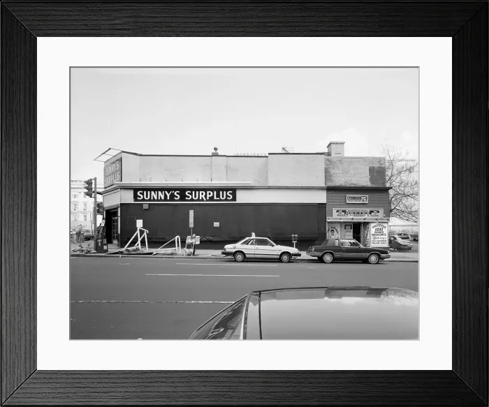Framed Print : Formerly Crandall's Theater, The Riley Building is now Sunny's Surplus, and Rendezvous Adult Magazines & Films, after having the top floor taken off and windows blocked