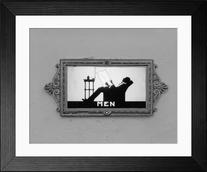 Framed Print : Movie Theaters, restroom door, detail depicting a man reading, from the Ambler Warner Theater, 108 East Butler Pike, Ambler, Pennsylvania, circa 1930s