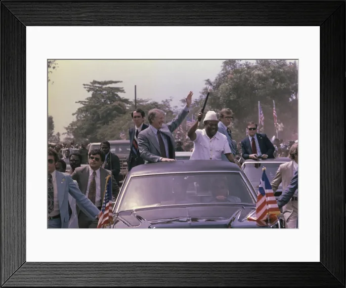 Framed Print : Jimmy Carter and President William Tobert 1813-1980 of Liberia wave from their motorcade during the President's visit to Monrovia Liberia
