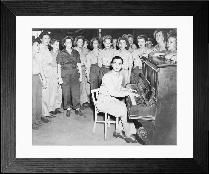 Framed Print : Irving Berlin (1888-1989), playing one of his songs as WACs sing, in Papua New Guinea during World War II Framed Print : Irving Berlin (1888-1989), playing one of his songs as WACs sing, in Papua New Guinea during World War II