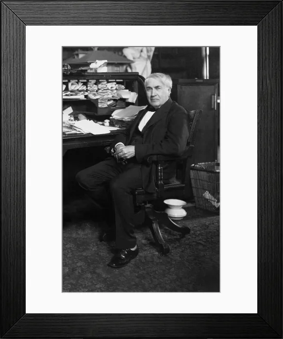 Framed Print : Thomas A. Edison (1847-1931) at his desk in his West Orange, New Jersey, laboratory, ca. 1913