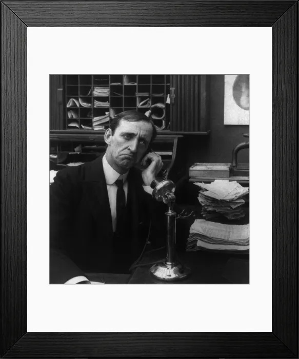 Framed Print : Businessman on telephone with disappointed look. 1906 Framed Print : Businessman on telephone with disappointed look. 1906