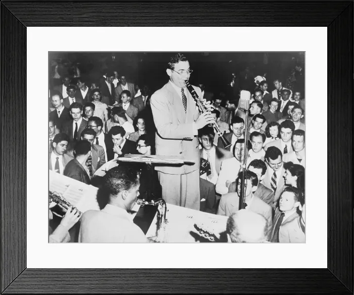 Framed Print : Benny Goodman (1909-86), playing clarinet, admirers look and listen. Goodman's Swing dance music was so loved, the dancers stopped to concentrate on the music. 1938