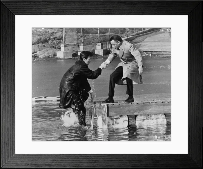 Framed Print : Laurence Harvey and Frank Sinatra doing a scene for the, THE MANCHURIAN CANDIDATE in Central Park, in which Harvey just walked off the pier. 1962 Framed Print : Laurence Harvey and Frank Sinatra doing a scene for the, THE MANCHURIAN CANDIDATE in Central Park, in which Harvey just walked off the pier. 1962