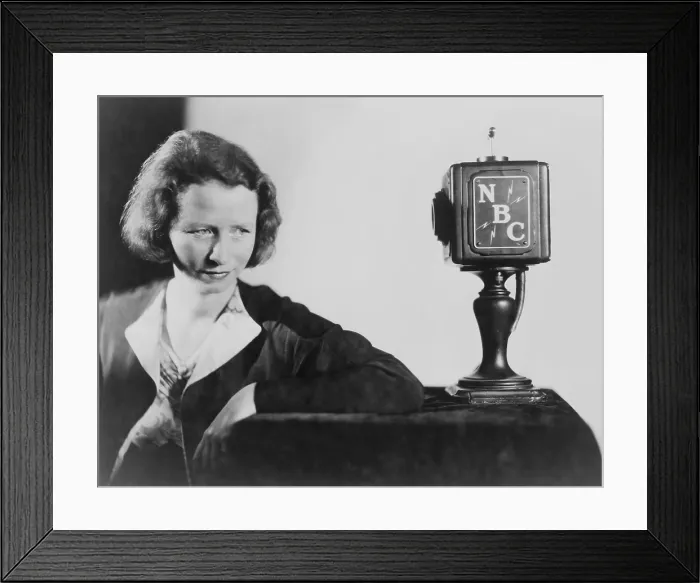 Framed Print : Edna St. Vincent Millay (1892-1950) American poet, seated behind NBC microphone reciting her poetry. 1945