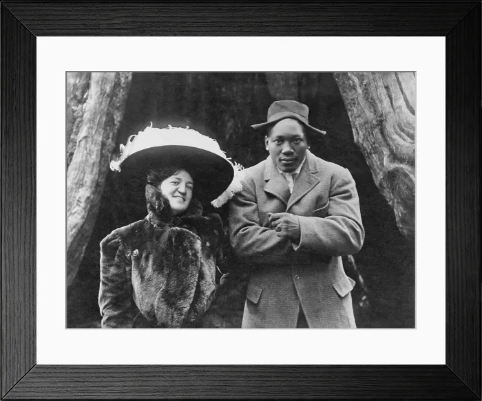 Framed Print : World Heavyweight Champion boxer Jack Johnson (1878-1946) and his white wife, in Vancouver, B.C. in 1909. Johnson is returning from his victory over Tommy Burns in Sydney