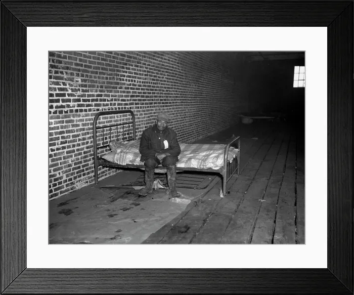 Framed Print : African American man in infirmary after flood, original title: Negro flood refugee in the Red Cross temporary infirmary of Forrest City, Arkansas