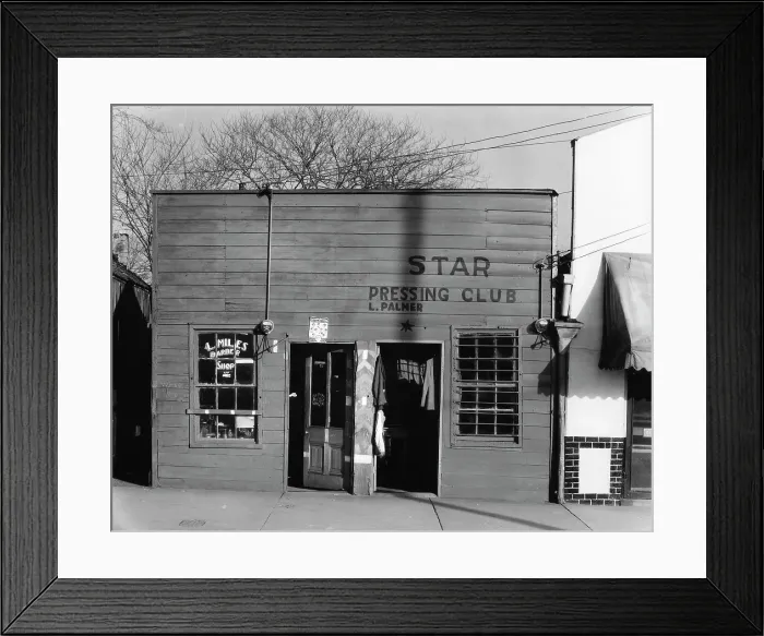 Framed Print : African American store fronts, original title: Shop fronts, laundry and barber shop, Negro shop, Vicksburg, Mississippi, photograph by Walker Evans, February, 1936
