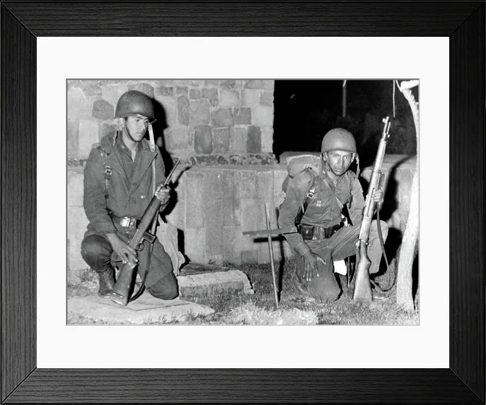 Framed Print : Mexico City: Mexican soldiers kneel by cross-marked site where an army trooper was killed by a sniper bullet during fighting with protesting students on October 3, 1968