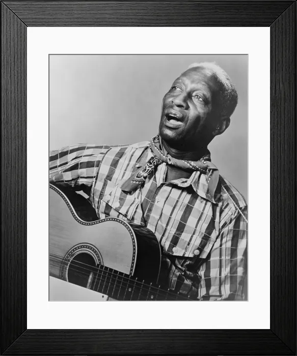 Framed Print : Huddie Ledbetter (1885-1949), known as Leadbelly, African American folk-blues singer, songwriter, and guitarist. He wrote and performed songs about Depression era suffering. 1948