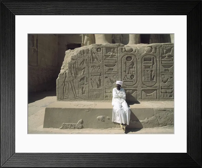 Framed Print : Great Temple of Rameses II. EGYPT. ASWAN. Abu Simbel. Great Temple of Rameses II. Pedestal of the third colossus (from left to right) at the entrance of the temple. Egyptian art