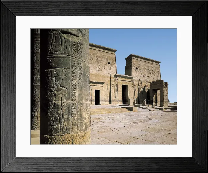 Framed Print : Temple of Isis. EGYPT. ASWAN. Philae. Temple of Isis. The first pylon of the temple from the columns of the western portico of the yard. Egyptian art. Ptolemaic period Framed Print : Temple of Isis. EGYPT. ASWAN. Philae. Temple of Isis. The first pylon of the temple from the columns of the western portico of the yard. Egyptian art. Ptolemaic period