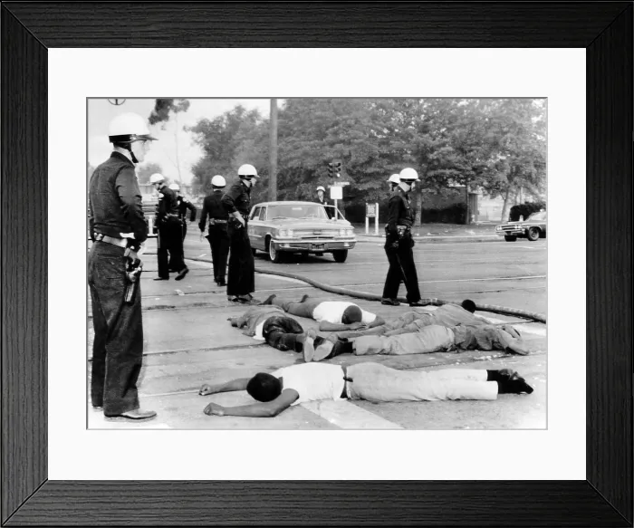 Framed Print : Police officers stand over suspected looters during the fourth day of riots in Watts, California, 1965. Courtesy: CSU Archives / Everett Collection