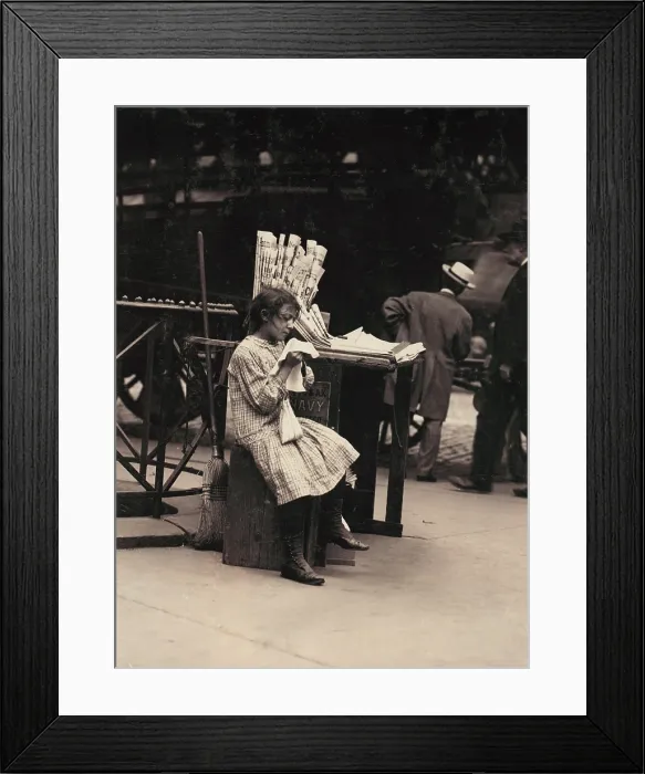 Framed Print : Child labor, Minnie Paster, 10 years old, tending news stand at Bowery and Bond street, New York, photograph by Lewis Wickes Hine, July, 1910