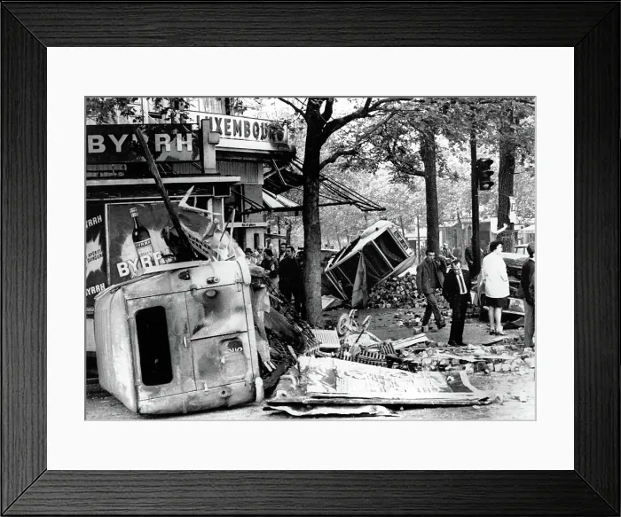 Framed Print : RIOTS-Parisians inspect overturned auto and other debris in the Edmond Rostand Square after riot. 5 / 25 / 98. Courtesy: CSU Archives  /  Everett Collection
