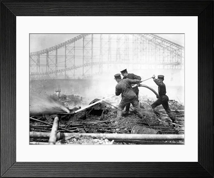 Framed Print : Coney Island, the Dreamland fire, men extinguishing the fire at Dreamland, roller coaster in background, Coney Island, New York, photograph, 1911