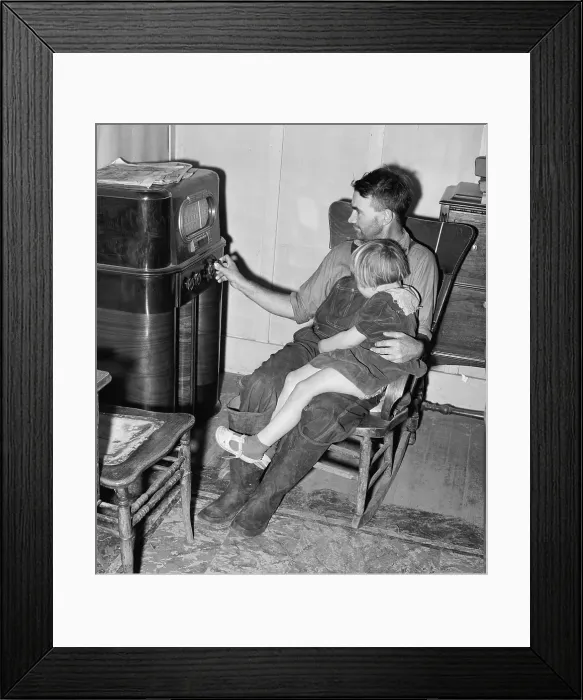 Framed Print : John Frost and daughter listening to their radio, a luxury item in their modest home for a family of seven