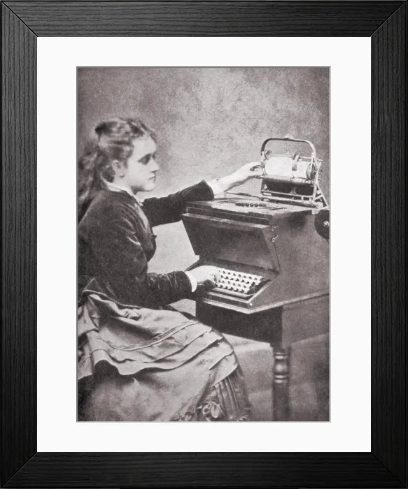 Framed Print : The daughter of inventor Christopher Sholes writing on one of his experimental typewriters in 1872