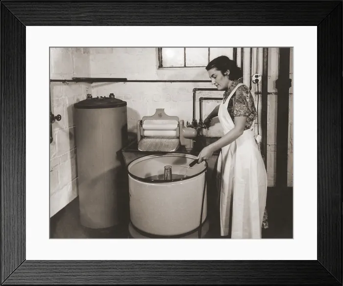 Framed Print : 1930s state of the art home laundry included a hot water heater, Hose filled wash tub with electric powered agitator and wringer