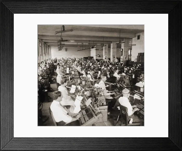 Framed Print : 100 workers setting type on monotype machines, each with a 120-key keyboard. At the U.S government's Bureau of Printing and Engraving. 1917