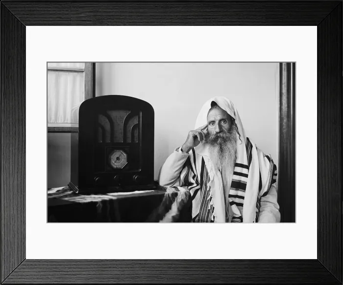 Framed Print : Yemenite Rabbi, in traditional robes and prayer shawl, listening to radio, ca. 1937