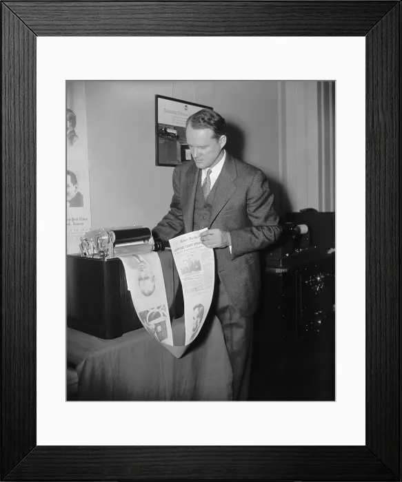 Framed Print : Machine printing out an experimental radio newspaper at the National Association of Broadcasters convention in 1938