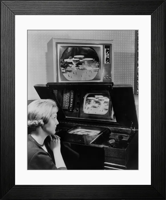 Framed Print : Woman looking at two television sets Framed Print : Woman looking at two television sets