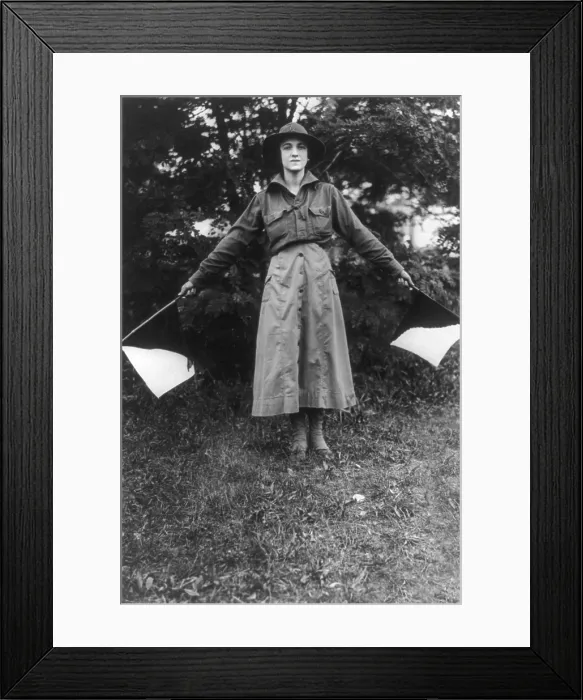 Framed Print : Uniformed woman using signal flags, wig wag girl of the Woman's Defense League in the camp near Washington DC, 1916 Framed Print : Uniformed woman using signal flags, wig wag girl of the Woman's Defense League in the camp near Washington DC, 1916