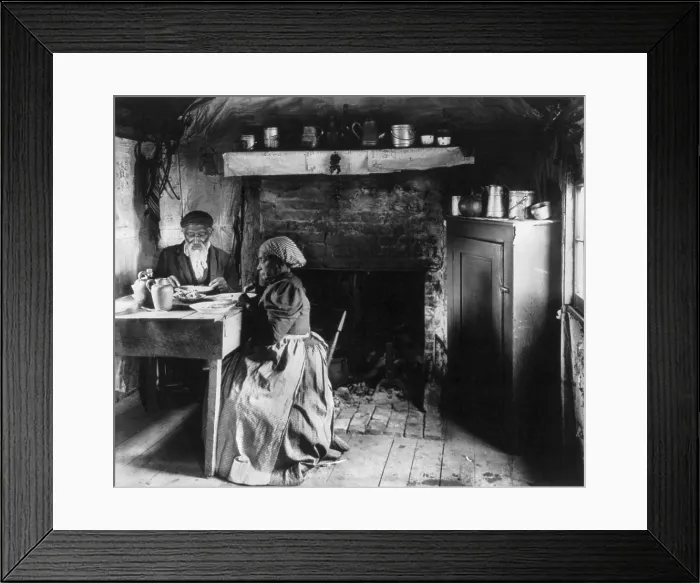 Framed Print : Elderly African American couple eating at the table by a fireplace, rural Virginia, photograph by Frances Benjamin JOhnston, circa 1899-1900