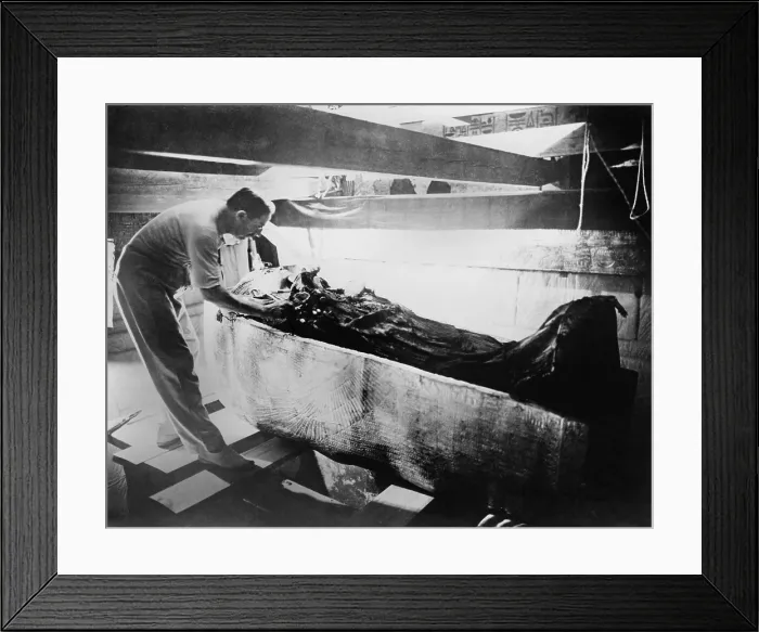 Framed Print : Howard Carter (1874-1939), turning back a shroud covering the inner coffin of Tutankhamen. March 1926 Framed Print : Howard Carter (1874-1939), turning back a shroud covering the inner coffin of Tutankhamen. March 1926