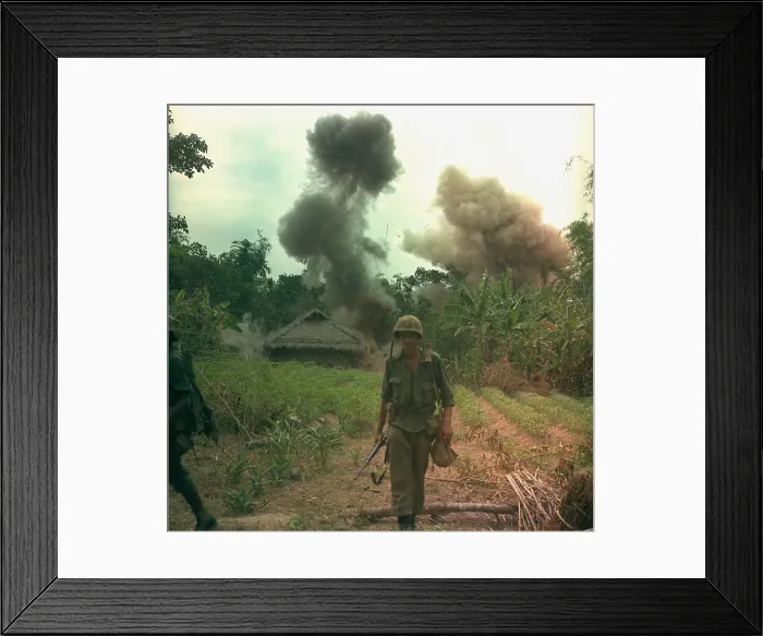 Framed Print : Vietnam War. US Marines walk away from blown up bunkers and tunnels used by the Viet Cong