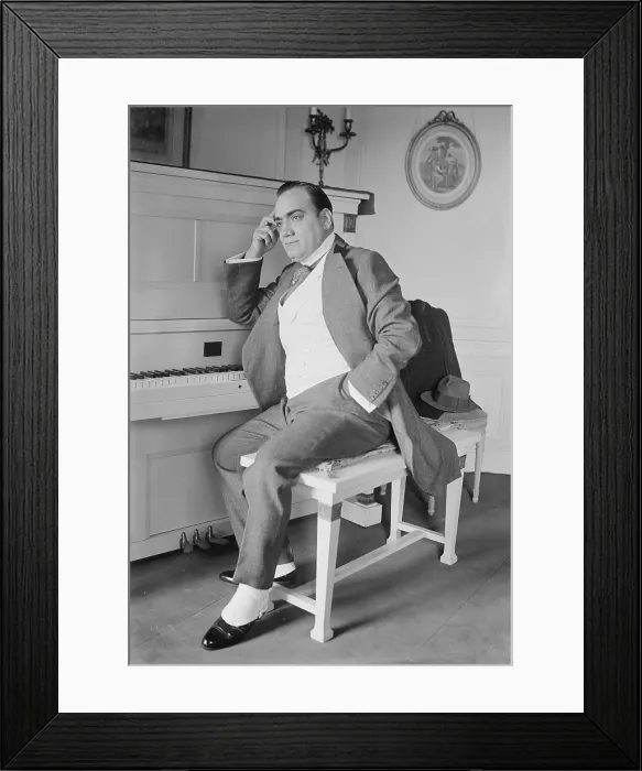 Framed Print : Enrico Caruso (1873-1921) seated at the piano in his New York apartment. Ca. 1915