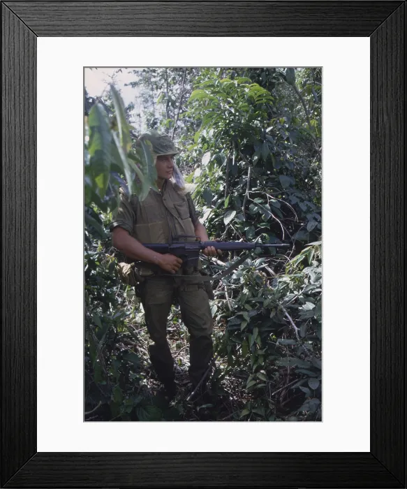 Framed Print : Vietnam War. US Marine moves through heavy grass in a deserted rice paddy while on patrol during a search and destroy operation in Quang Tri Province. Nov.-Dec. 1967 Framed Print : Vietnam War. US Marine moves through heavy grass in a deserted rice paddy while on patrol during a search and destroy operation in Quang Tri Province. Nov.-Dec. 1967
