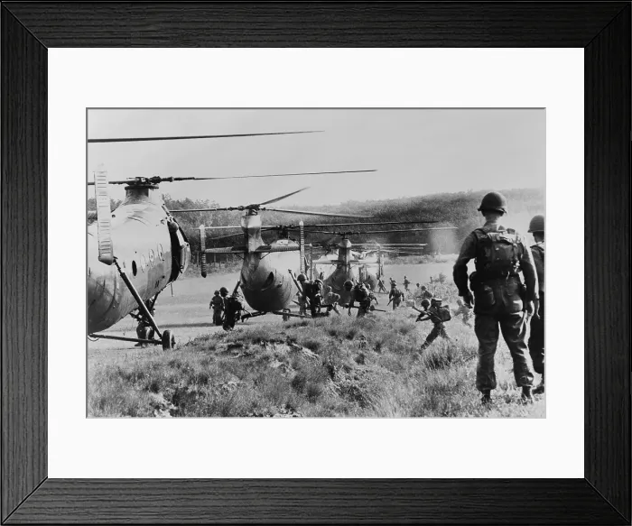 Framed Print : Vietnam War. South Vietnamese troops run to board helicopters for an airborne anti-guerrilla operation in jungles near Saigon, as American advisors watch. 1962