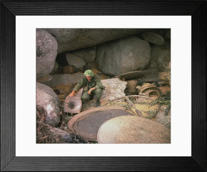 Framed Print : Vietnam War. US Army infantryman, searches a destroyed Viet Cong supply cave in the An Lao Valley during Operation Pershing. July 7, 1967