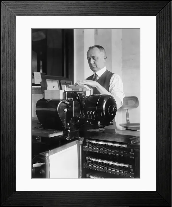 Framed Print : Man loading punch cards into a tabulating machine used in the 1920 United States census Framed Print : Man loading punch cards into a tabulating machine used in the 1920 United States census