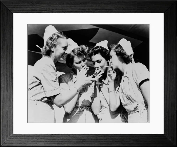 Framed Print : Army nurses lighting up their cigarettes in 1947, when smoking was seen as a simple pleasure rather than a health hazard